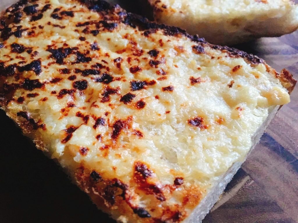 A fast and easy vegetarian side dish for Italian dinners. Ready in less than 10 minutes, this Sourdough Garlic Bread is kid friendly and packed full of flavor. 