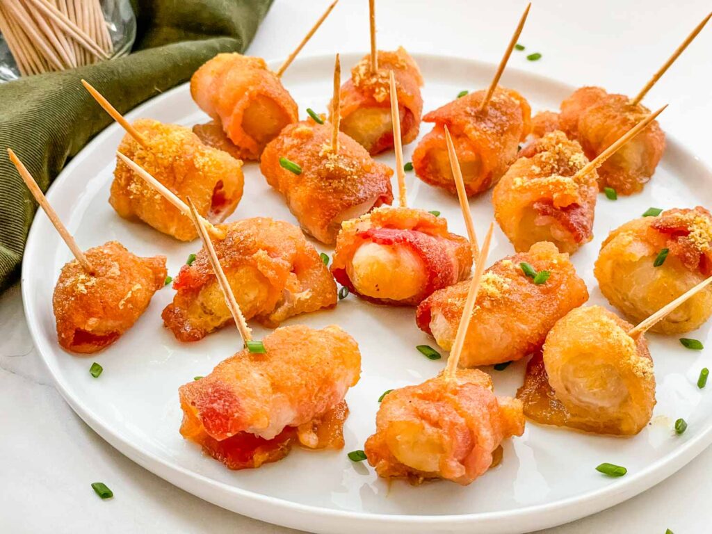 Bacon Wrapped Water Chestnuts on a white plate