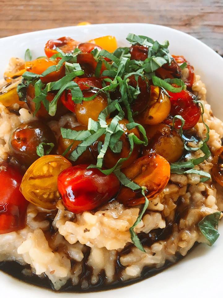 Balsamic Caprese Risotto is a unique twist on a classic Italian comfort food recipe. The gooey mozzarella is cut by the acidity of the balsamic vinegar, brightened up with fresh basil and fresh cherry tomatoes. All on a creamy vegetarian Parmesan cheese risotto. A house favorite! #italian #risotto #caprese