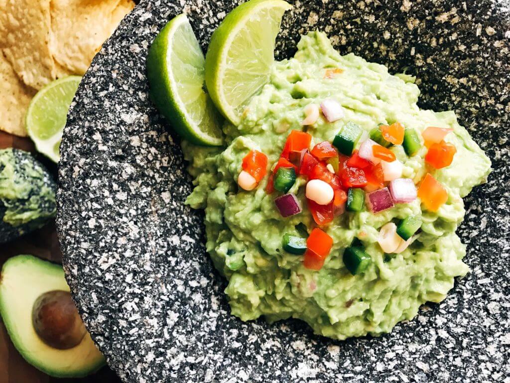 Ready in minutes, this fast and simple Better than Chipotle Guacamole is fresh and full of bright flavors. Perfect as an appetizer for the holiday or game day, as well as on Mexican food. Healthy, vegan, vegetarian. Three Olives Branch | www.threeolivesbranch.com