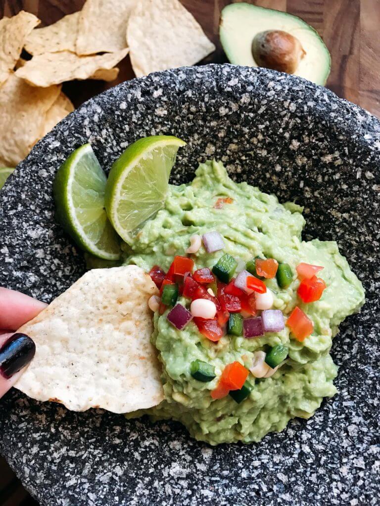 Ready in minutes, this fast and simple Better than Chipotle Guacamole is fresh and full of bright flavors. Perfect as an appetizer for the holiday or game day, as well as on Mexican food. Healthy, vegan, vegetarian. Three Olives Branch | www.threeolivesbranch.com