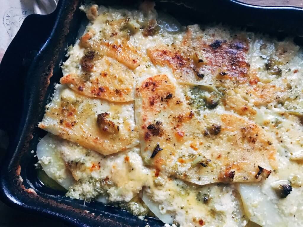A perfect side dish for any event or holiday. We make these every Easter! A twist on a classic dish by using broccoli. Great to make ahead and bake day-of. Vegetarian. Broccoli Cheese Scalloped Potatoes | Three Olives Branch | www.threeolivesbranch.com