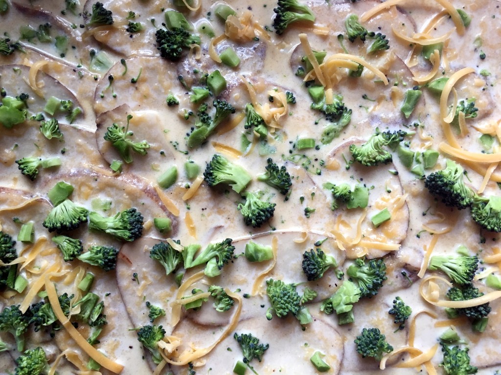 A perfect side dish for any event or holiday. We make these every Easter! A twist on a classic dish by using broccoli. Great to make ahead and bake day-of. Vegetarian. Broccoli Cheese Scalloped Potatoes | Three Olives Branch | www.threeolivesbranch.com