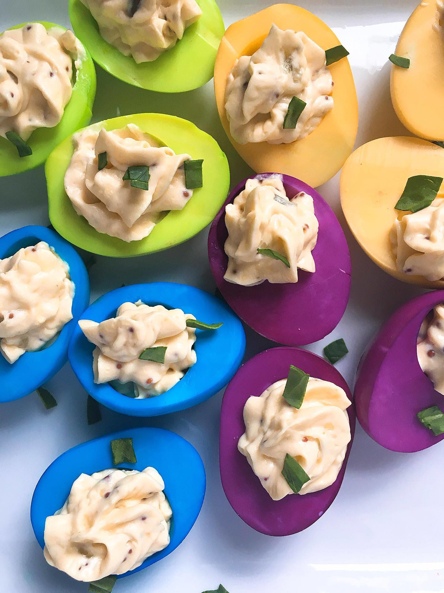 A pile of brightly Colored Deviled Eggs
