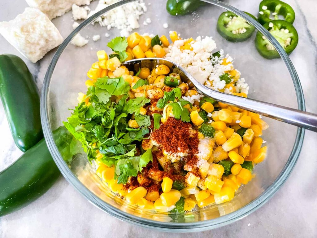 The ingredients being added to a glass bowl