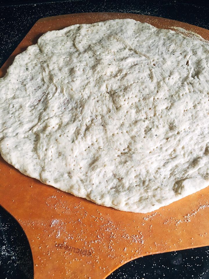 Homemade pizza dough is so easy! Just a few ingredients and minimal kneeding time to get an airy and flavorful pizza crust that you can use with any sauce and topping. You will never want a store bought crust again! Oregano Garlic Pizza Dough | Three Olives Branch
