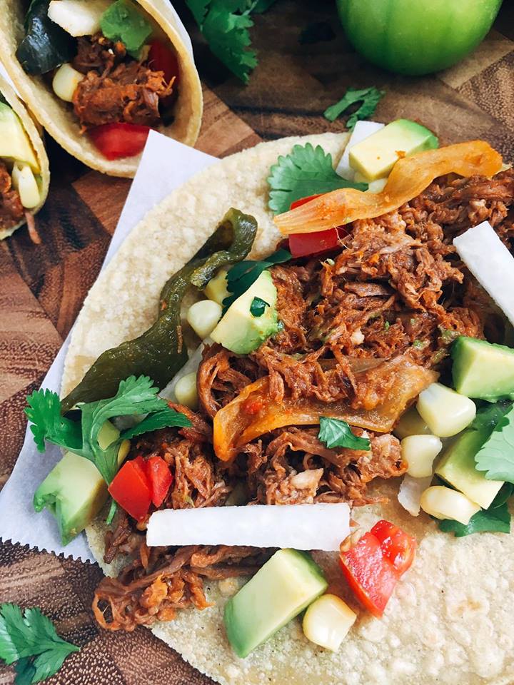 Just 5 minutes to throw everything in a slow cooker will give you an amazing Barbacoa packed full of flavor! These tacos and quick and customizable to please even picky eaters. Check out the post for a time saving hack to shred all this beautiful meat! | Three Olives Branch
