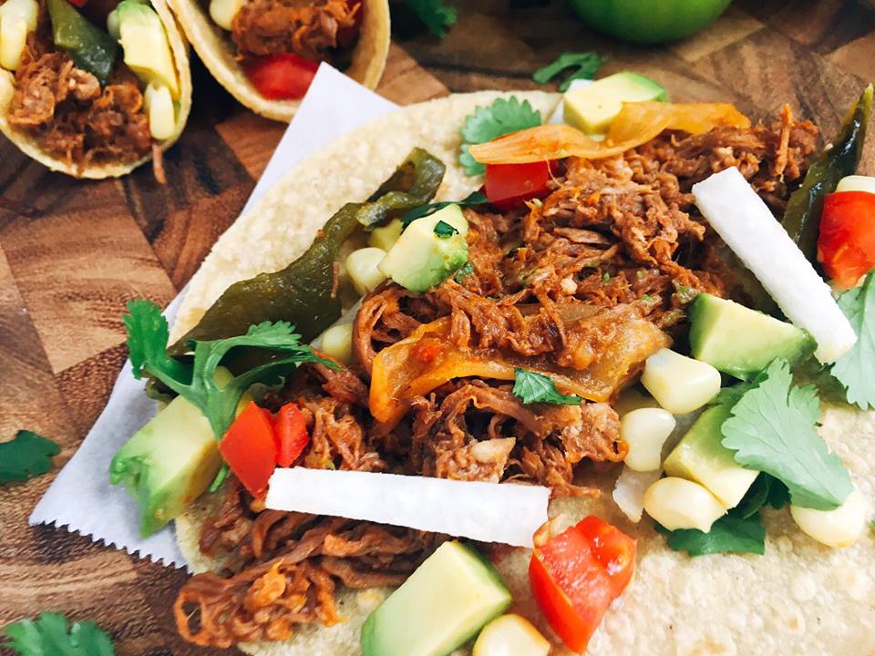 Just 5 minutes to throw everything in a slow cooker will give you an amazing Barbacoa packed full of flavor! These tacos and quick and customizable to please even picky eaters. Check out the post for a time saving hack to shred all this beautiful meat! | Three Olives Branch