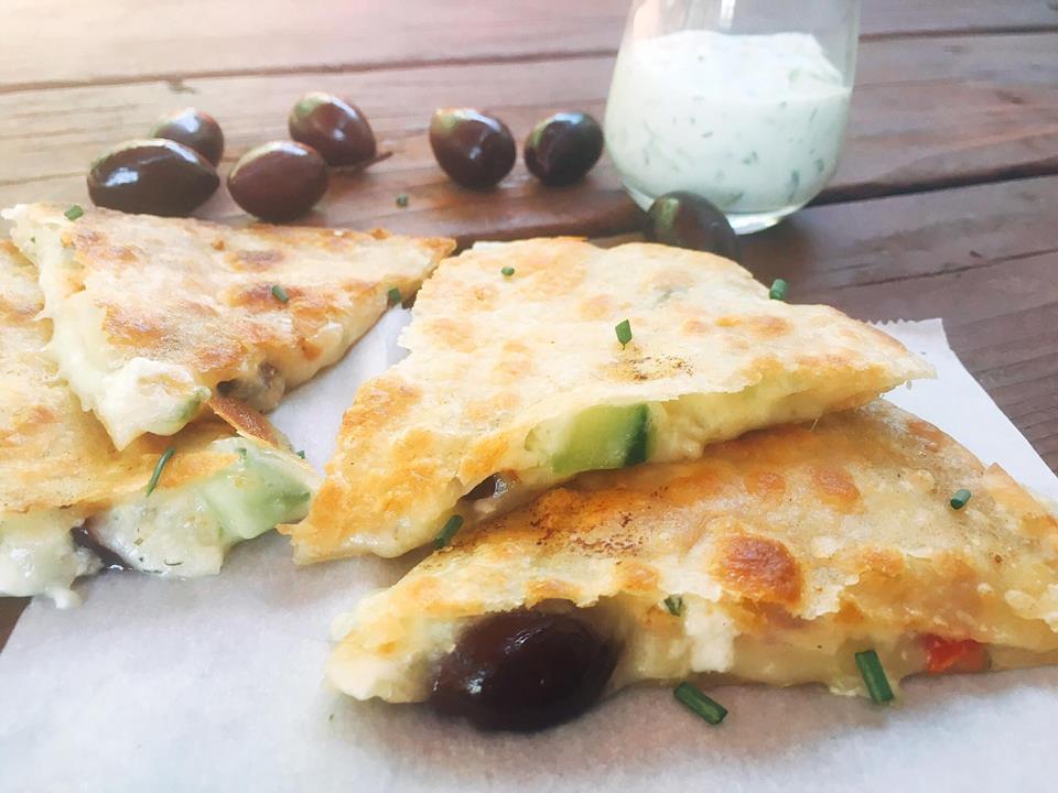 Ready in just 10 minutes! Greek Tzatziki Quesadilla is a great way to sneak some veggies into a fun snack or meal! All the flavors of Greek salad in quesadilla form with some tzatziki sauce inside for extra flavor and dipping. Vegetarian recipe | Three Olives Branch | www.threeolivesbranch.com