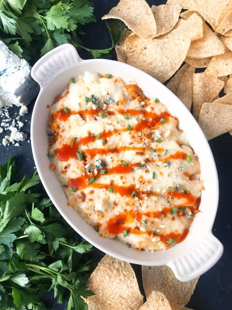 Only 15 minutes from start to finish, Buffalo Chicken is the star in this Buffalo Chicken Cheese Dip. A perfect appetizer recipe for the big game, using all the traditional flavors of buffalo wings with three cheeses. Fast, simple, and gluten free. #buffalochicken #gameday #cheesedip