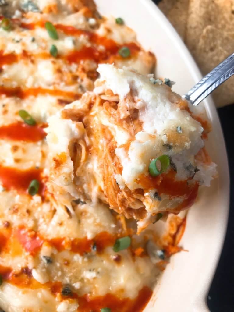 Only 15 minutes from start to finish, Buffalo Chicken is the star in this Buffalo Chicken Cheese Dip. A perfect appetizer recipe for the big game, using all the traditional flavors of buffalo wings with three cheeses. Fast, simple, and gluten free. #buffalochicken #gameday #cheesedip