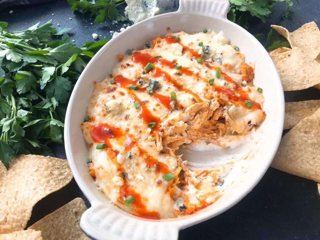 Only 15 minutes from start to finish, Buffalo Chicken is the star in this Buffalo Chicken Cheese Dip. A perfect appetizer recipe for the big game, using all the traditional flavors of buffalo wings with three cheeses. Fast, simple, and gluten free. #buffalochicken #gameday #cheesedip