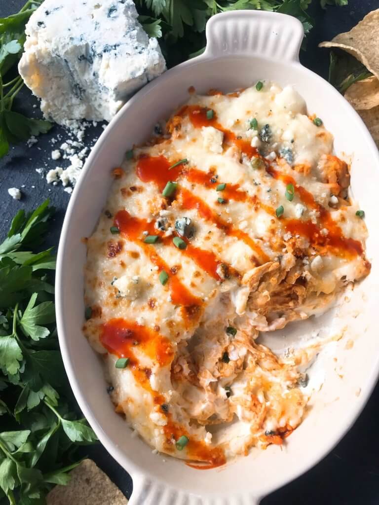 Only 15 minutes from start to finish, Buffalo Chicken is the star in this Buffalo Chicken Cheese Dip. A perfect appetizer recipe for the big game, using all the traditional flavors of buffalo wings with three cheeses. Fast, simple, and gluten free. #buffalochicken #gameday #cheesedip