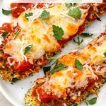 Pin of two Three Cheese Zucchini Parmesan on a white plate with title at top