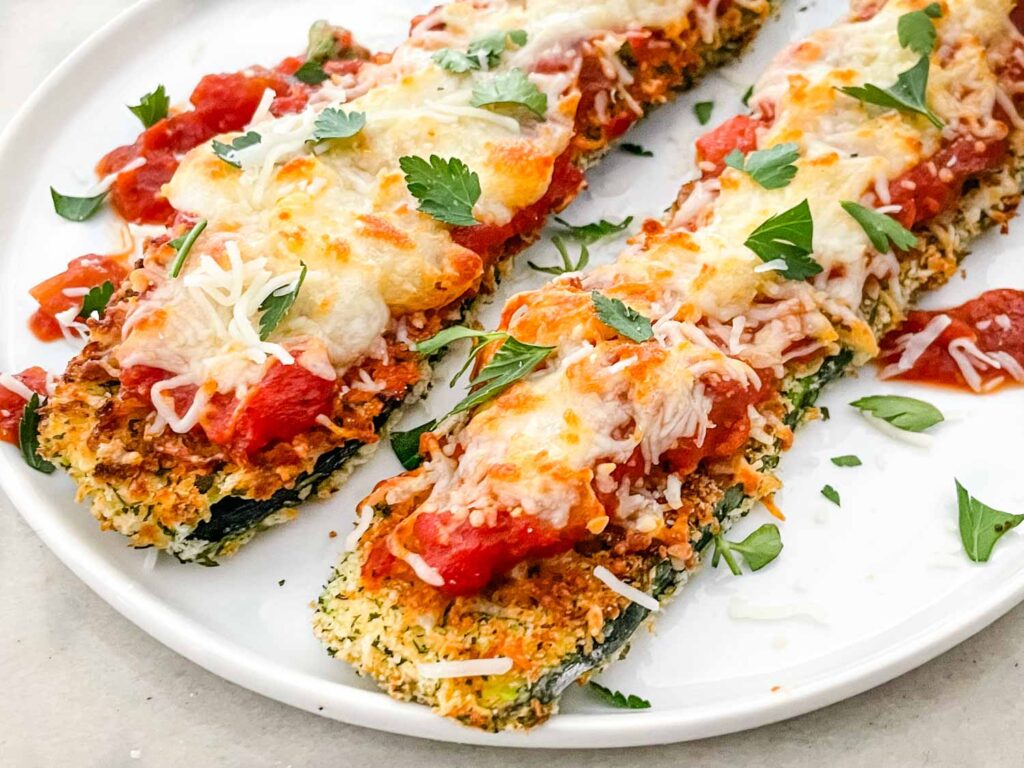 Closer view of some Three Cheese Zucchini Parmesan on a white plate