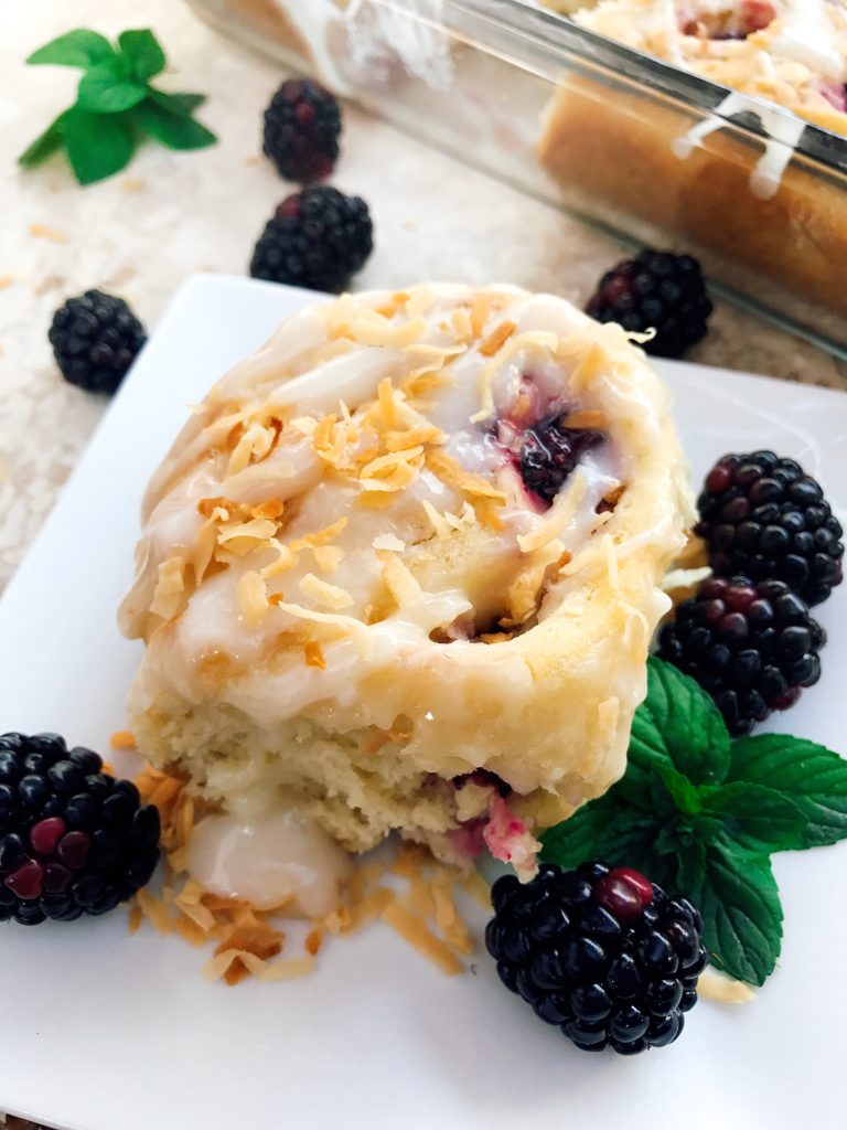 Sweet and tangy, these rolls are a special treat! Tart blackberries are paired with toasted coconut for a unique and delicious sweet roll! Perfect for breakfast or brunch and holiday mornings! Make them the day before for an easy morning. Vegetarian recipe. | Three Olives Branch | Blackberry Toasted Coconut Sweet Rolls | www.threeolivesbranch.com 