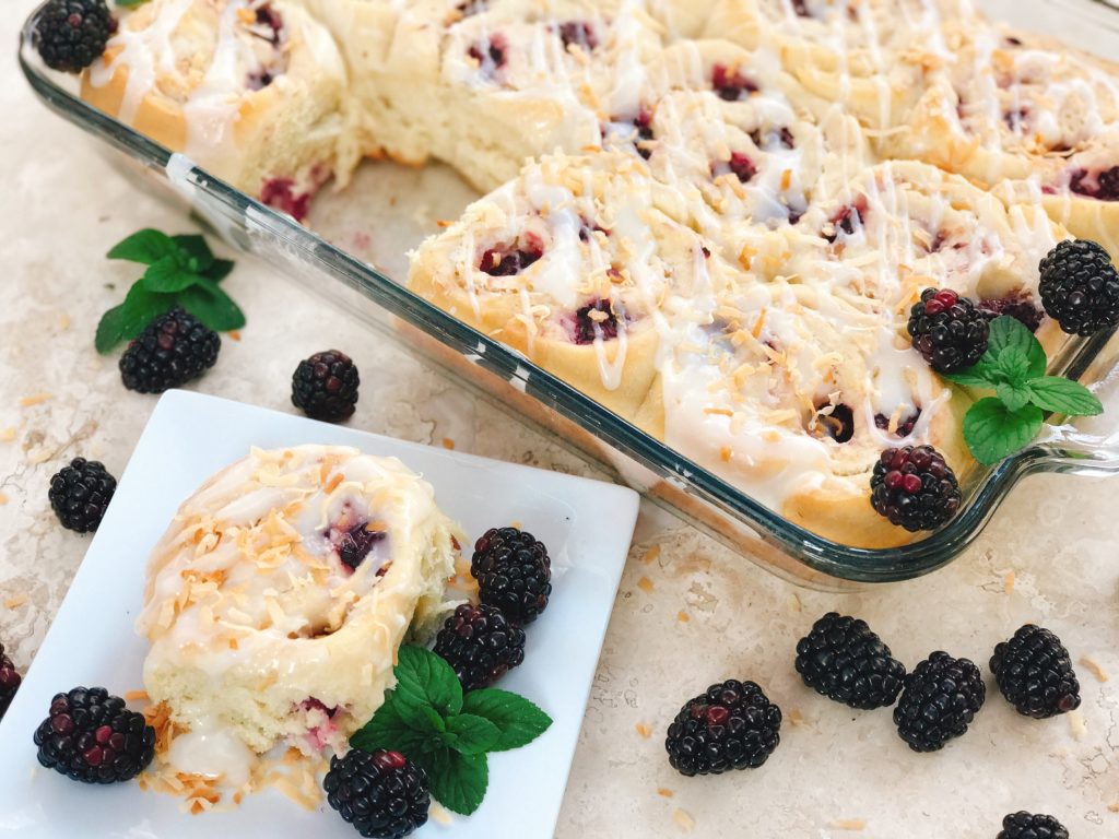 Sweet and tangy, these rolls are a special treat! Tart blackberries are paired with toasted coconut for a unique and delicious sweet roll! Perfect for breakfast or brunch and holiday mornings! Make them the day before for an easy morning. Vegetarian recipe. | Three Olives Branch | Blackberry Toasted Coconut Sweet Rolls | www.threeolivesbranch.com 