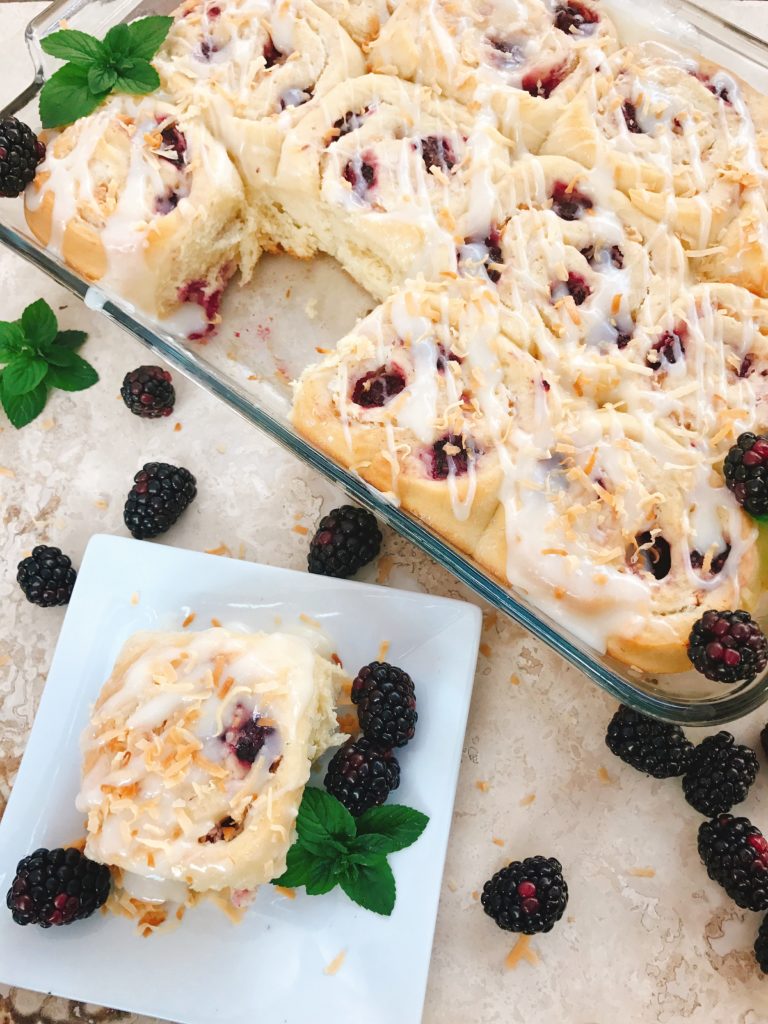 Sweet and tangy, these rolls are a special treat! Tart blackberries are paired with toasted coconut for a unique and delicious sweet roll! Perfect for breakfast or brunch and holiday mornings! Make them the day before for an easy morning. Vegetarian recipe. | Three Olives Branch | Blackberry Toasted Coconut Sweet Rolls | www.threeolivesbranch.com 