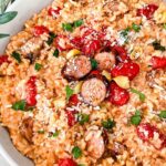 Pin of Roasted Tomato and Sausage Risotto in a large dish with title at top.