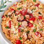 Looking down on a dish of Roasted Tomato and Sausage Risotto.