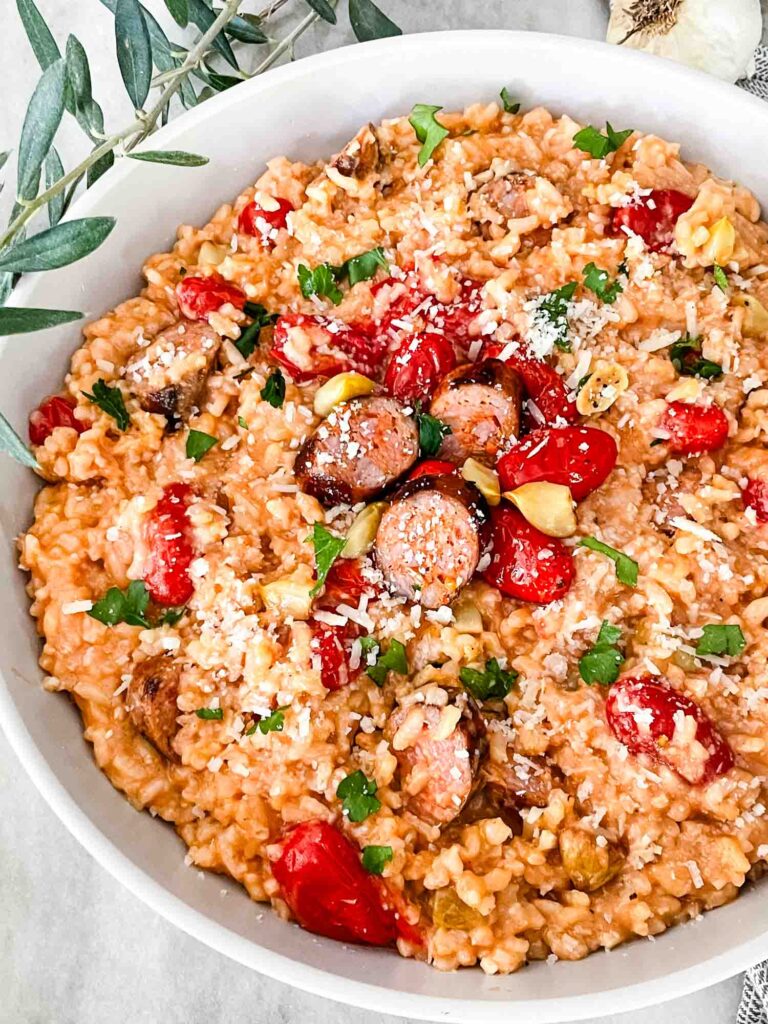 Looking down on a dish of Roasted Tomato and Sausage Risotto.