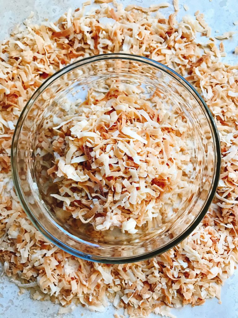 Learn how to make toasted coconut in minutes! Perfect for your holiday baking and desserts. Toasting brings out a nuttiness and texture to coconut. Great for Christmas cookies and baking, snacks, breakfasts, and all types of desserts. Make as much as you need! Vegan and vegetarian. Fast and easy. How to Toast Coconut | Three Olives Branch | www.threeolivesbranch.com