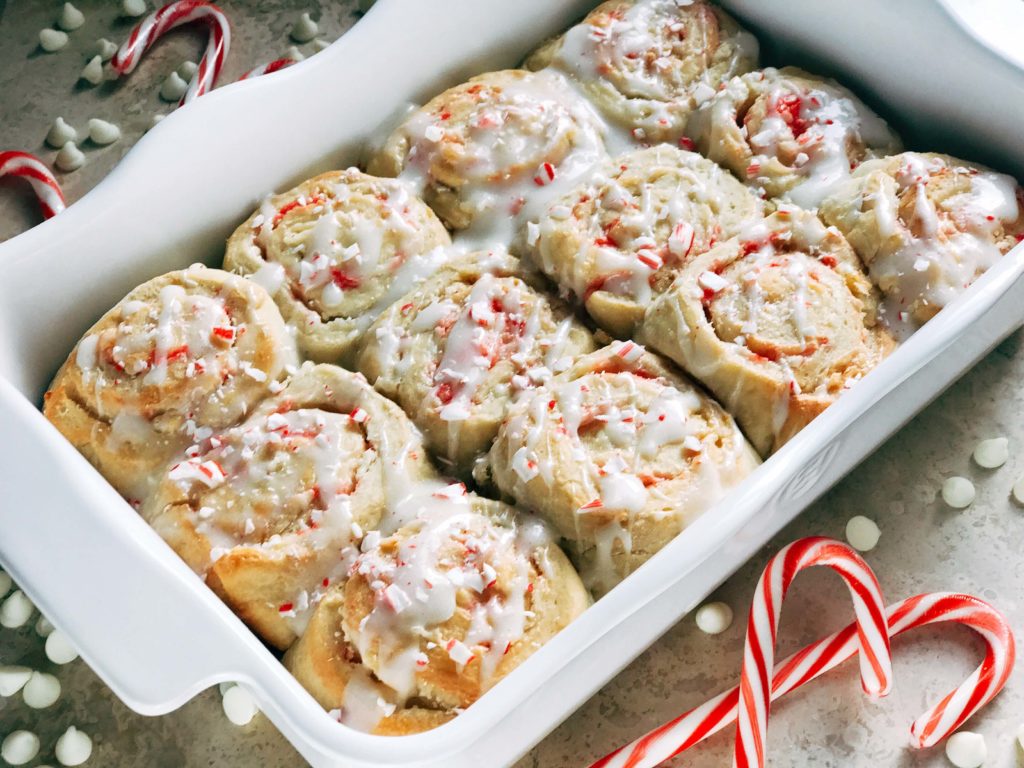 A tray of sweet rolls with candy canes