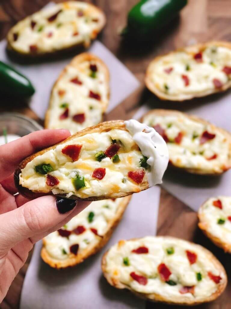 Perfect for the big game, these Jalapeno Popper Potato Skins are one of our favorites! Control the spicy heat level with the amount of jalapeno you use and this is perfect as an appetizer, especially for football games! Easy to make and vegetarian friendly. Three Olives Branch | www.threeolivesbranch.com 