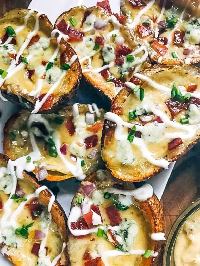 A pile of Bacon and Bourbon Blue Cheese Potato Skins