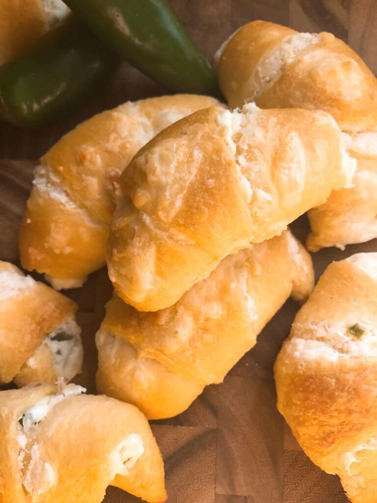 Pile of Jalapeno Popper Crescent Rolls on a board