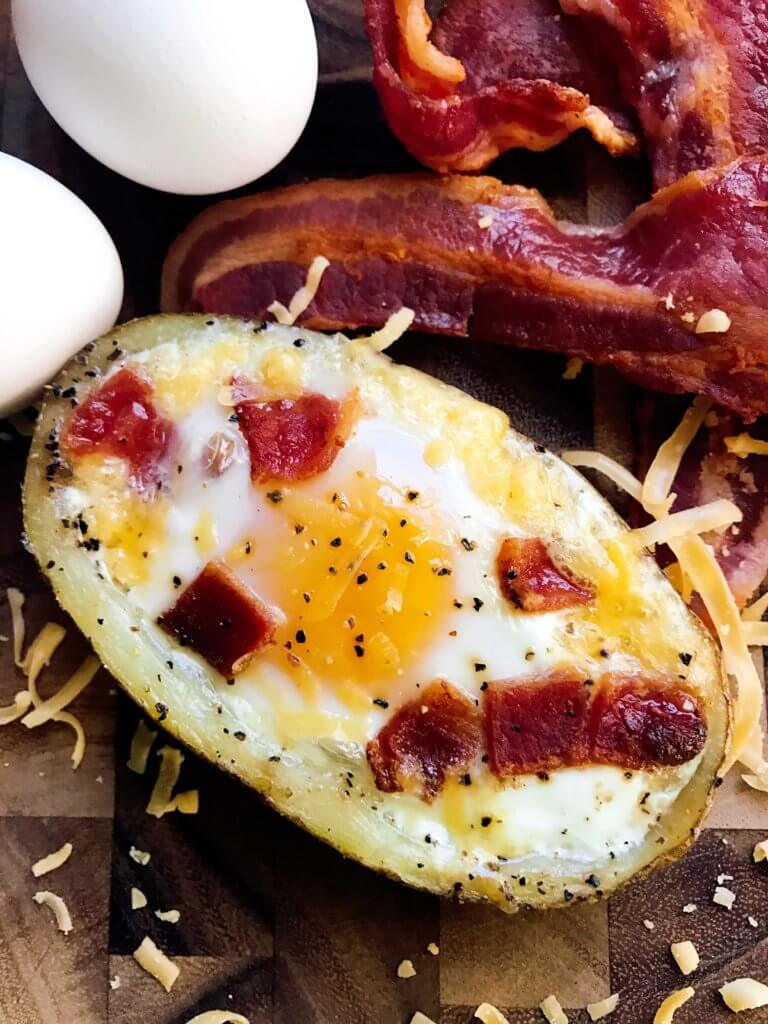 Make in advance for a fun appetizer, snack, breakfast, brunch, or lunch! A twist on some classics, kid friendly and perfect for the big game or Super Bowl! A party favorite. Bacon and Eggs Potato Skins | Three Olives Branch | www.threeolivesbranch.com