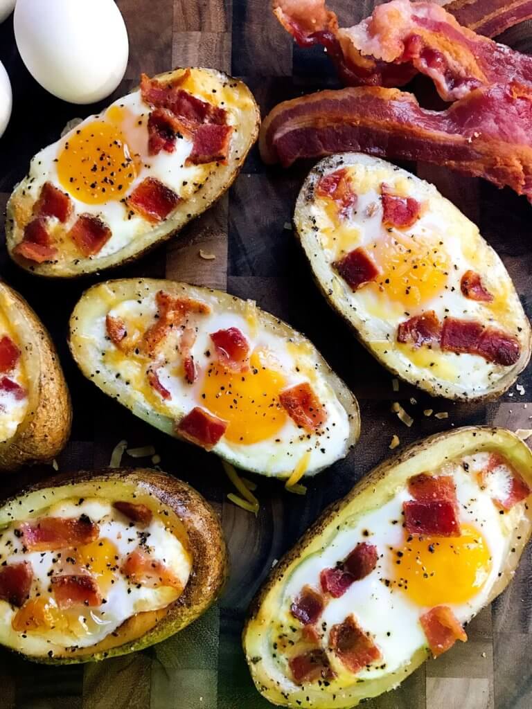 Make in advance for a fun appetizer, snack, breakfast, brunch, or lunch! A twist on some classics, kid friendly and perfect for the big game or Super Bowl! A party favorite. Bacon and Eggs Potato Skins | Three Olives Branch | www.threeolivesbranch.com