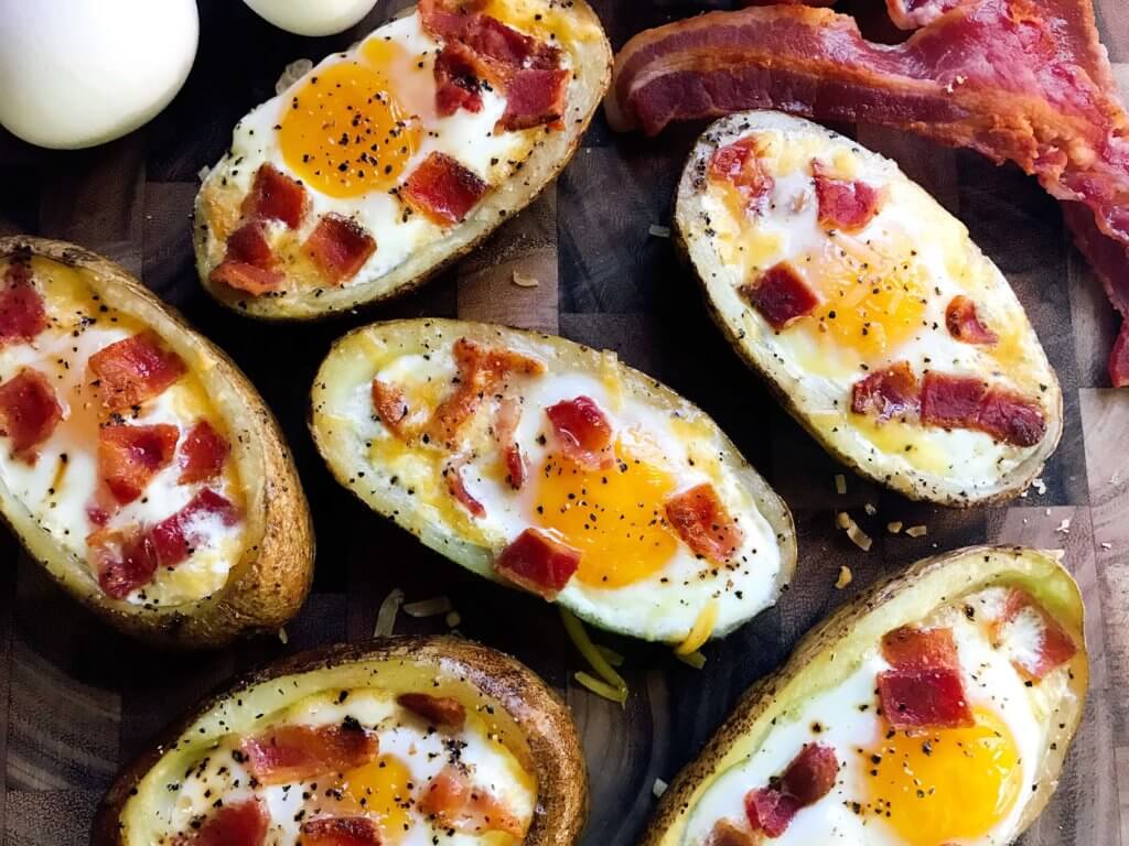 Make in advance for a fun appetizer, snack, breakfast, brunch, or lunch! A twist on some classics, kid friendly and perfect for the big game or Super Bowl! A party favorite. Bacon and Eggs Potato Skins | Three Olives Branch | www.threeolivesbranch.com