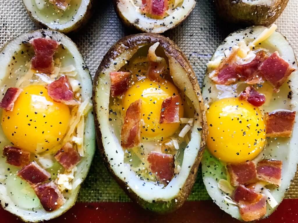 Make in advance for a fun appetizer, snack, breakfast, brunch, or lunch! A twist on some classics, kid friendly and perfect for the big game or Super Bowl! A party favorite. Bacon and Eggs Potato Skins | Three Olives Branch | www.threeolivesbranch.com