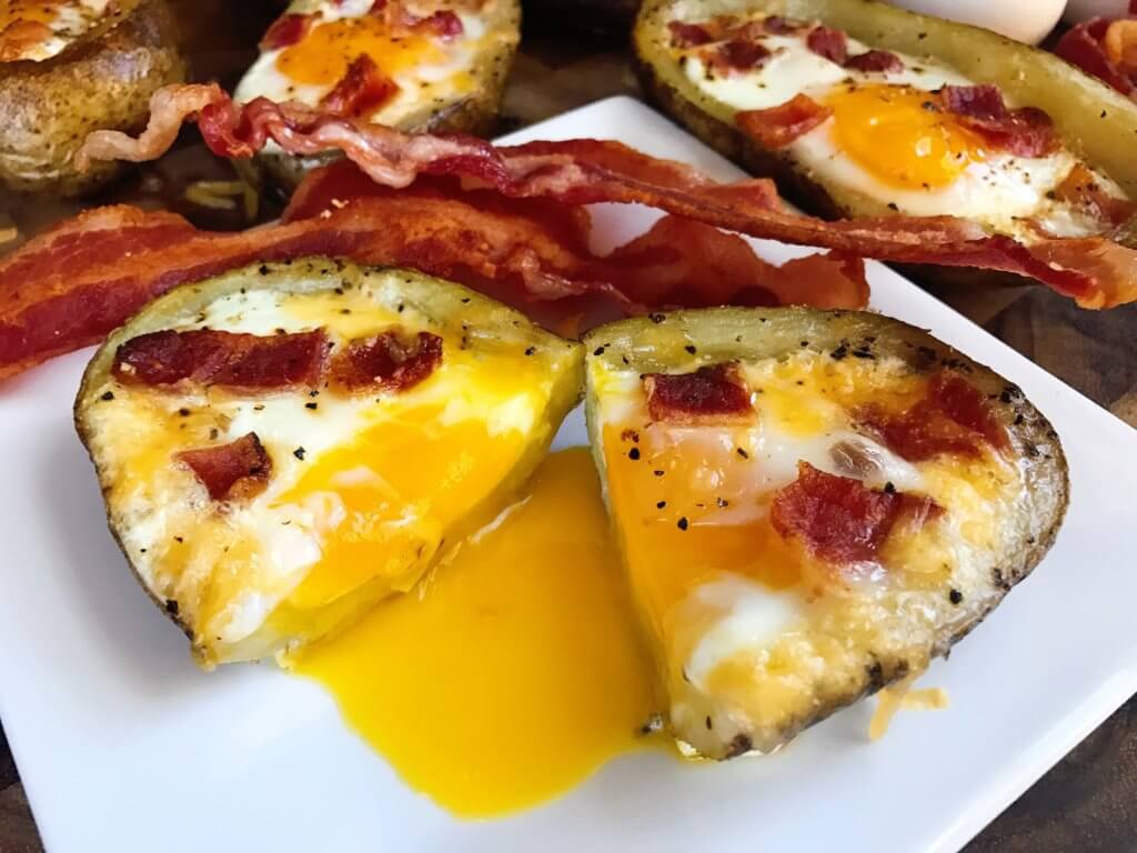 Make in advance for a fun appetizer, snack, breakfast, brunch, or lunch! A twist on some classics, kid friendly and perfect for the big game or Super Bowl! A party favorite. Bacon and Eggs Potato Skins | Three Olives Branch | www.threeolivesbranch.com