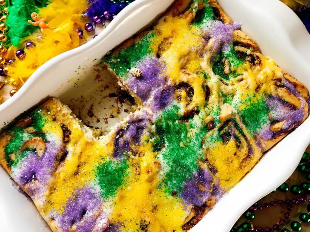 Make in advance for an easy breakfast! Comfort food perfect for the holiday. Vegetarian and kid friendly. Pecan, cinnamon, and flaky dough. Mardi Gras King Cake Cinnamon Rolls | Three Olives Branch | www.threeolivesbranch.com