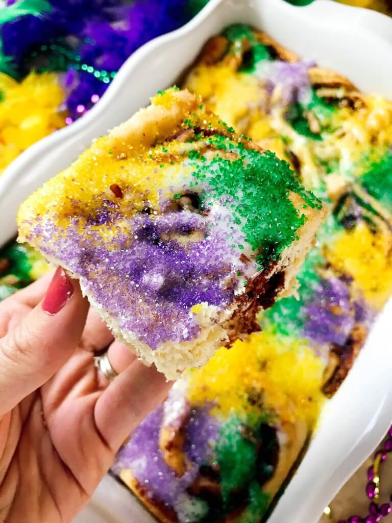 Make in advance for an easy breakfast! Comfort food perfect for the holiday. Vegetarian and kid friendly. Pecan, cinnamon, and flaky dough. Mardi Gras King Cake Cinnamon Rolls | Three Olives Branch | www.threeolivesbranch.com