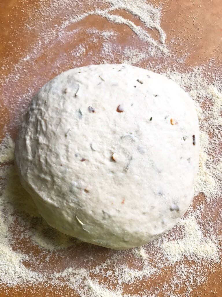 Homemade pizza dough with a little kick! Amp up plain dough with the flavors of rosemary and red pepper, classic Italian ingredients. Delicious with a variety of toppings. Makes two 12" pizzas and perfect for a party pizza night. Vegetarian. Rosemary Red Pepper Pizza Dough | Three Olives Branch | www.threeolivesbranch.com