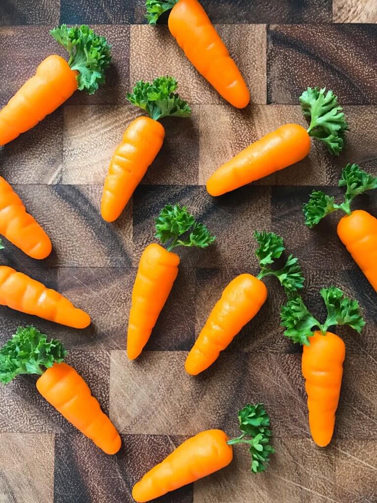 In 10 minutes you can have these adorable marzipan carrots ready for your Easter or spring celebration! Vegan and completely edible, they are a fun and festive decoration for the holiday that you can use on anything. Fast, simple, and easy way to add some flair to your event. How to Make Marzipan Carrots | Three Olives Branch | www.threeolivesbranch.com