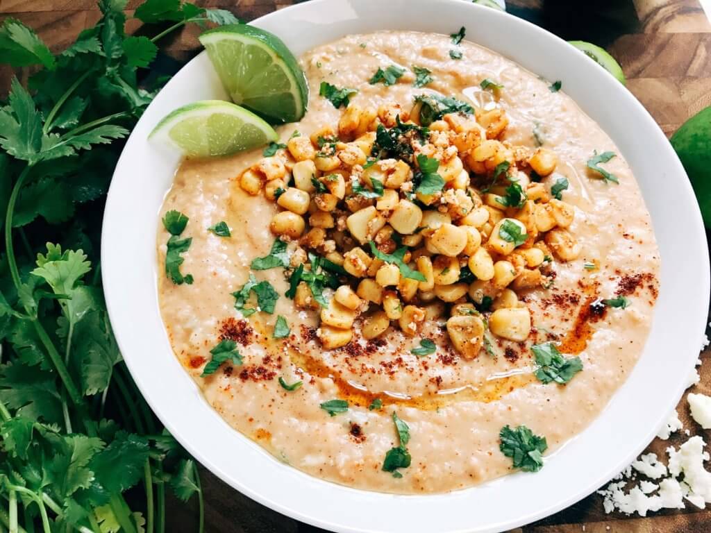 Ready in less than 10 minutes, this hummus is perfect for entertaining! Serve it up as an appetizer or snack, perfect for Mexican parties, fiestas, and Cinco de Mayo. Corn, lime, cotija cheese, and chili powder are the star here, using the same flavors of a traditional Elote (Mexican Street Corn) in a healthy and fresh dip. Vegetarian and vegan friendly, fast, simple, and healthy. Mexican Street Corn Hummus | Three Olives Branch | www.threeolivesbranch.com