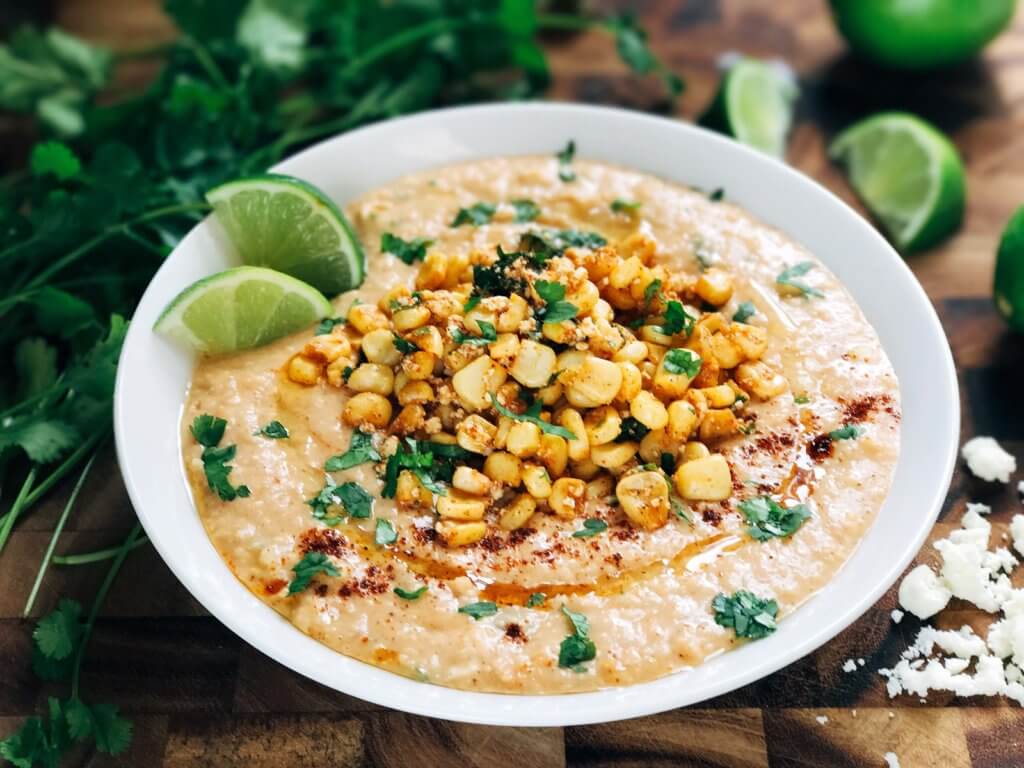 Ready in less than 10 minutes, this hummus is perfect for entertaining! Serve it up as an appetizer or snack, perfect for Mexican parties, fiestas, and Cinco de Mayo. Corn, lime, cotija cheese, and chili powder are the star here, using the same flavors of a traditional Elote (Mexican Street Corn) in a healthy and fresh dip. Vegetarian and vegan friendly, fast, simple, and healthy. Mexican Street Corn Hummus | Three Olives Branch | www.threeolivesbranch.com