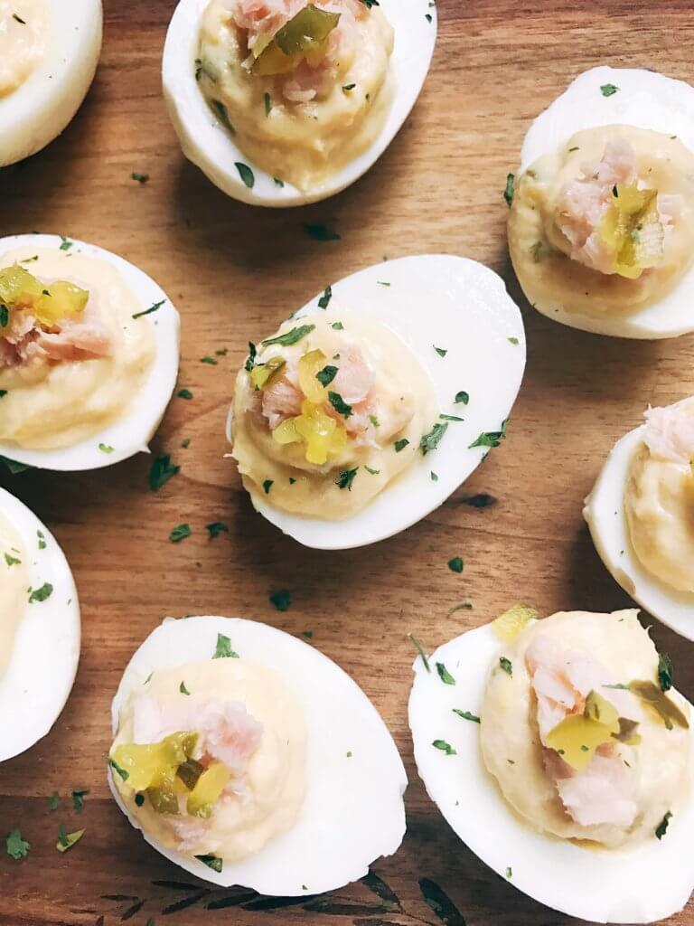 Ready in 10 minutes, fast and simple deviled eggs with unique flavors similar to tuna salad. Tuna, relish, mayo, and mustard brighten up these eggs for a unique appetizer or snack. Great for any party, event, game, or holiday like Easter. Tuna Luna Deviled Eggs | Three Olives Branch | www.threeolivesbranch.com