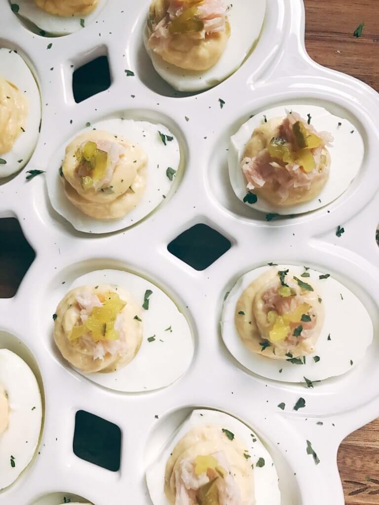 Ready in 10 minutes, fast and simple deviled eggs with unique flavors similar to tuna salad. Tuna, relish, mayo, and mustard brighten up these eggs for a unique appetizer or snack. Great for any party, event, game, or holiday like Easter. Tuna Luna Deviled Eggs | Three Olives Branch | www.threeolivesbranch.com