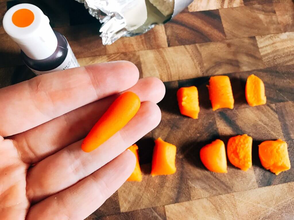 In 10 minutes you can have these adorable marzipan carrots ready for your Easter or spring celebration! Vegan and completely edible, they are a fun and festive decoration for the holiday that you can use on anything. Fast, simple, and easy way to add some flair to your event. How to Make Marzipan Carrots | Three Olives Branch | www.threeolivesbranch.com