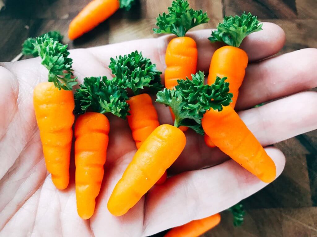 In 10 minutes you can have these adorable marzipan carrots ready for your Easter or spring celebration! Vegan and completely edible, they are a fun and festive decoration for the holiday that you can use on anything. Fast, simple, and easy way to add some flair to your event. How to Make Marzipan Carrots | Three Olives Branch | www.threeolivesbranch.com