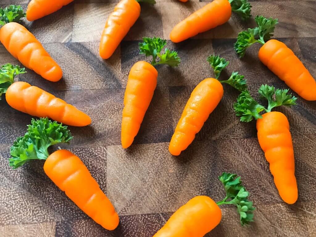 In 10 minutes you can have these adorable marzipan carrots ready for your Easter or spring celebration! Vegan and completely edible, they are a fun and festive decoration for the holiday that you can use on anything. Fast, simple, and easy way to add some flair to your event. How to Make Marzipan Carrots | Three Olives Branch | www.threeolivesbranch.com