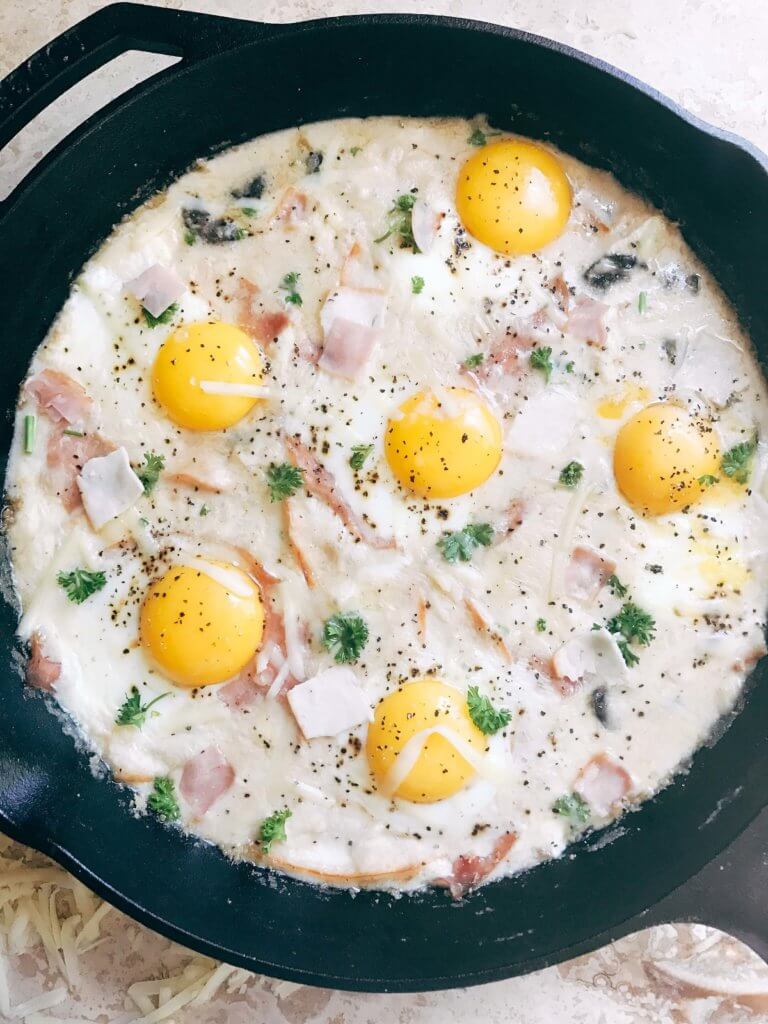 Great for spring entertaining, this dish is perfect for any meal of the day. Breakfast, brunch, lunch, or dinner, classic flavors of Chicken Cordon Bleu are combined with the style of shakshuka. Ham, chicken, cheese sauce, and eggs. Can be served on a piece of grilled chicken, bread, or eat it straight! Fast and simple to make, perfect for entertaining and parties. A great start to holiday mornings. Chicken Cordon Bleu Shakshuka | Three Olives Branch | www.threeolivesbranch.com