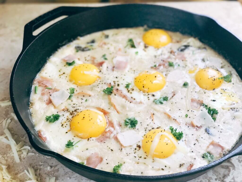 Great for spring entertaining, this dish is perfect for any meal of the day. Breakfast, brunch, lunch, or dinner, classic flavors of Chicken Cordon Bleu are combined with the style of shakshuka. Ham, chicken, cheese sauce, and eggs. Can be served on a piece of grilled chicken, bread, or eat it straight! Fast and simple to make, perfect for entertaining and parties. A great start to holiday mornings. Chicken Cordon Bleu Shakshuka | Three Olives Branch | www.threeolivesbranch.com