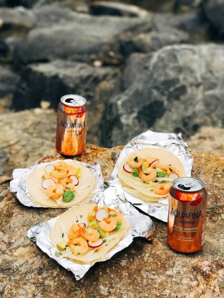 Less than 30 minutes for these simple and fresh shrimp tacos. Perfect for on-the-go food, full of bright and fresh flavors. Shrimp, orange, grapefruit, avocado, and jicama inspired by Aquafina Sparkling Water. A great twist on a seafood taco for Mexican night. Quick and easy to make, perfect for summer. Grapefruit Orange Shrimp Tacos with Jicama Slaw | Three Olives Branch | www.threeolivesbranch.com