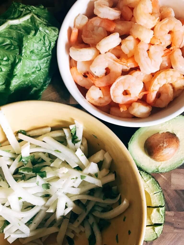 Less than 30 minutes for these simple and fresh shrimp tacos. Perfect for on-the-go food, full of bright and fresh flavors. Shrimp, orange, grapefruit, avocado, and jicama inspired by Aquafina Sparkling Water. A great twist on a seafood taco for Mexican night. Quick and easy to make, perfect for summer. Grapefruit Orange Shrimp Tacos with Jicama Slaw | Three Olives Branch | www.threeolivesbranch.com